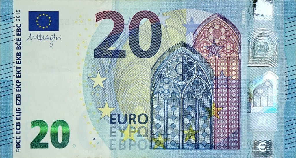 Fragment part of 20 euro banknote close-up with small blue details. European currency bill