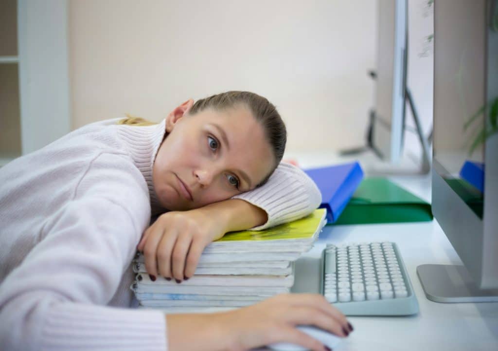 young woman is sad at the workplace. office work concep