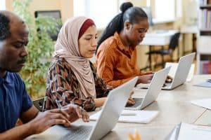 Migrants Students Using Laptops